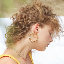 Load image into Gallery viewer, Tai Gold Wavy Hoops - 2 Sizes