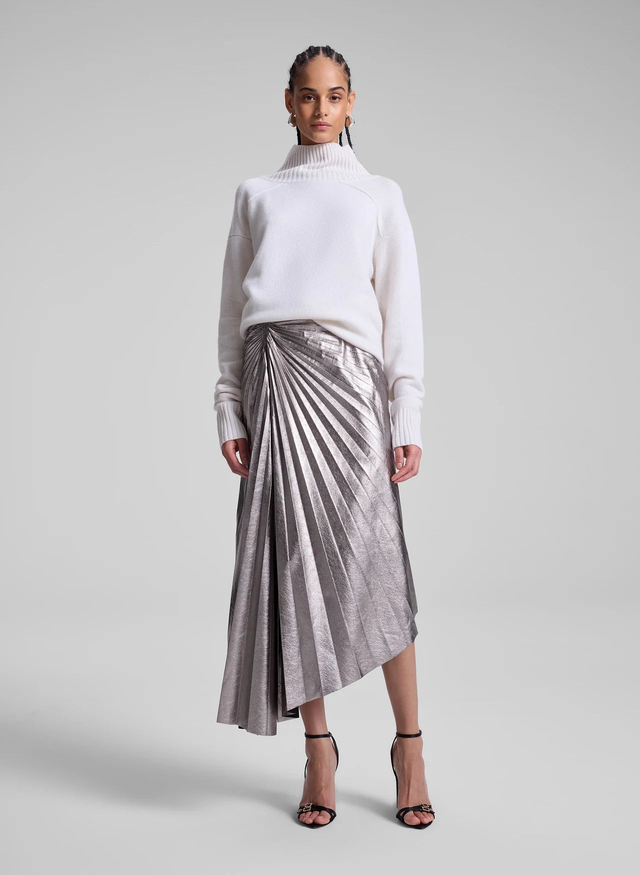 White sweater with metallic skirt for winter brunch